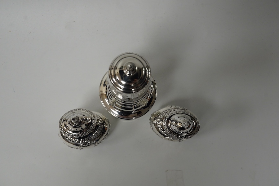 A George V silver sugar castor, by S. Blanckensee & Sons Ltd, Chester, 1929, 15.9cm and a pair of small late Victorian silver pepperettes, 8.4oz. Condition - poor to fair